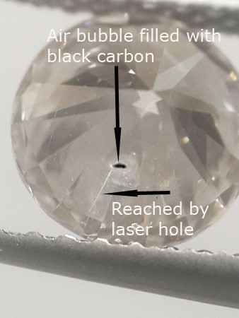 diamond with carbon filled spot, laser tunnel to it